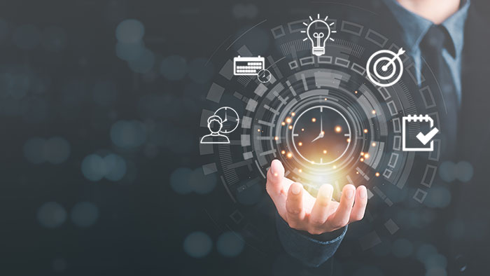 Businessman showing virtual icon in hand, time management concep